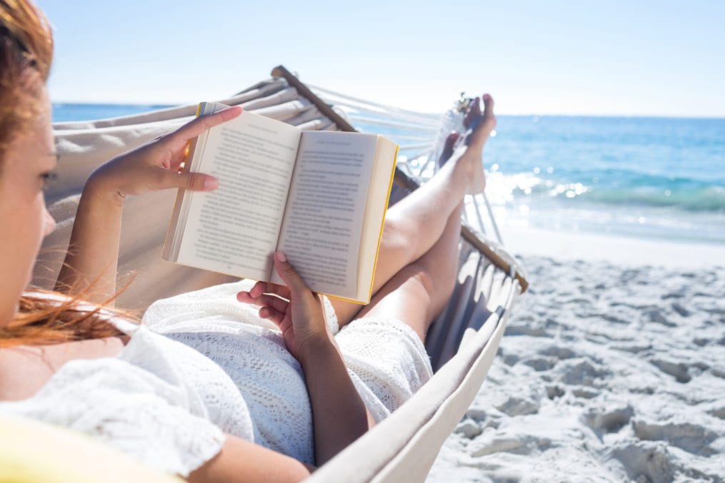 Woman reading on the beach